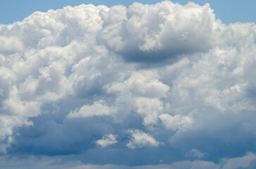 Many large clouds against the sky