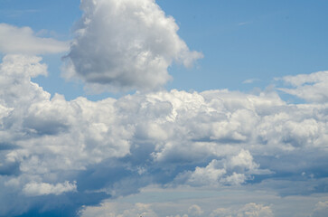 Many large clouds against the sky
