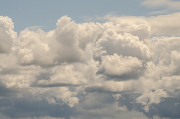 Many large clouds against the sky