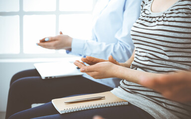 Business people clapping at meeting or conference, close-up of hands. Group of unknown businessmen...