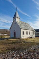 Fototapeta premium View of Syltefjord chapel in summer with clouds in the sky, Syltefjorden, Norway.