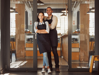 Portrait, happy and couple at door of cafe with confidence, woman or small business owners...