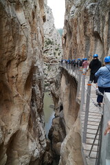 Province of Malaga, Andalusia, southern Spain. Unidentifiable visitors wearing helmets against...
