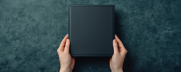 Hands holding a framed diploma, symbolizing cherished memories and academic achievement