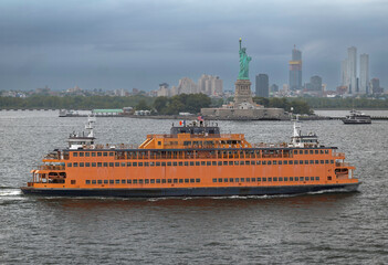 Ferry Passing Stature of Liberty in Manhattan Harbor © Daniel Teplitz