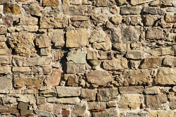 The photo shows a close-up of a stone wall