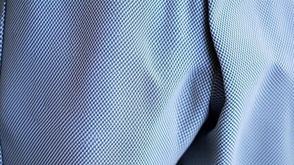 Naklejka premium Close-up shot of textured pants fabric, showing intricate weave and subtle sheen, close-up, pants