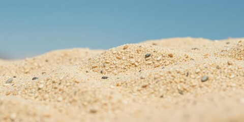 Fototapeta premium Rough and gritty beige sand texture background with tiny grains, background, pattern
