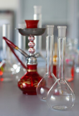 composition of red hookah and chemical glass flasks