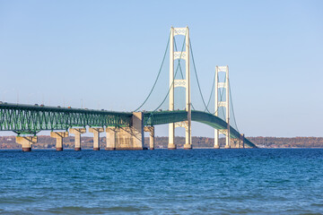 Obraz premium Mackinac Bridge suspension bridge connects the Upper and Lower peninsulas of the U.S. state of Michigan. It spans the Straits of Mackinac connecting Lake Michigan and Lake Huron, Great Lakes