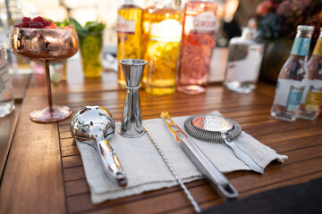 professional accessories on the table for making an alcoholic cocktail by a bartender
