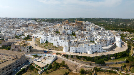 Obraz premium Aerial view of Old Town of Ostuni, in the province of Brindisi, in Puglia, Italy. Ostuni's citadel is commonly referred to as 