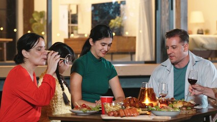 Family gather celebrate holiday. Parents, grandparents and girl together to talk and have dinner...