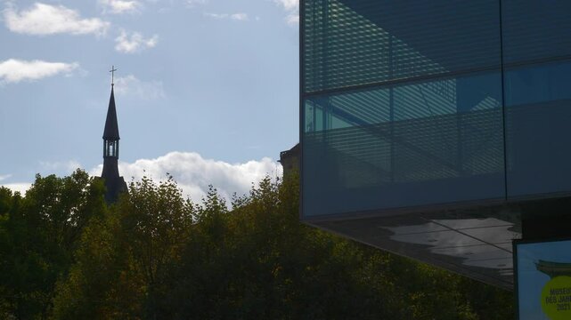 day time stuttgart city famous modern art museum cube building front church tower slow motion panorama 4k germany