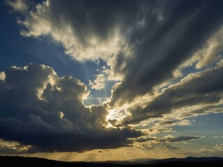 Dramatic Sunset Sky with Golden Rays and Storm Clouds