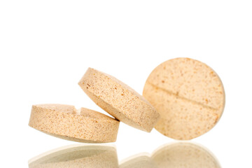 Medical pills, macro, isolated on white background.