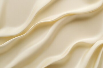 Obraz premium Soft cream silk seamless backdrop with a smooth, liquid finish and gentle, grainy texture in light beige tones