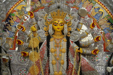A detailed view of a vibrant Durga Puja idol display, showcasing intricate decorations