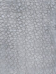 Fototapeta premium The background of a gray brick wall is a close-up. The surface of the gray brick.