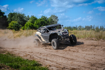 Fototapeta premium ATV and UTV riding in sandy dusty track. Amateur competitions. 4x4.