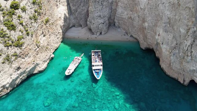 Stunning Aerial Drone Footage Capturing a Luxurious Yacht Sailing Between the Breathtaking Ionian Sea Coastlines of Zakynthos, Showcasing the Clear Waters and Scenic Beauty of This Mediterranean Parad