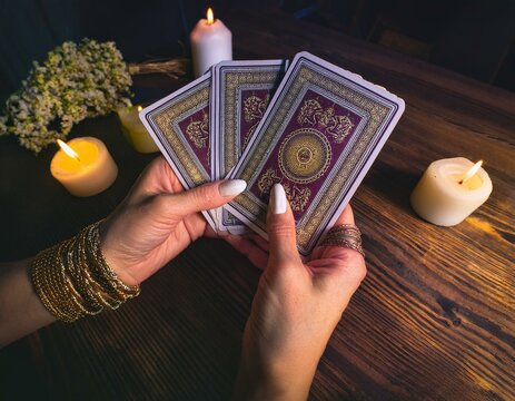 fortuneteller holding tarot cards