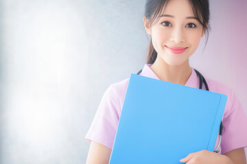 Obraz premium smiling female healthcare professional holding blue folder, wearing pink uniform, exuding friendly and approachable demeanor
