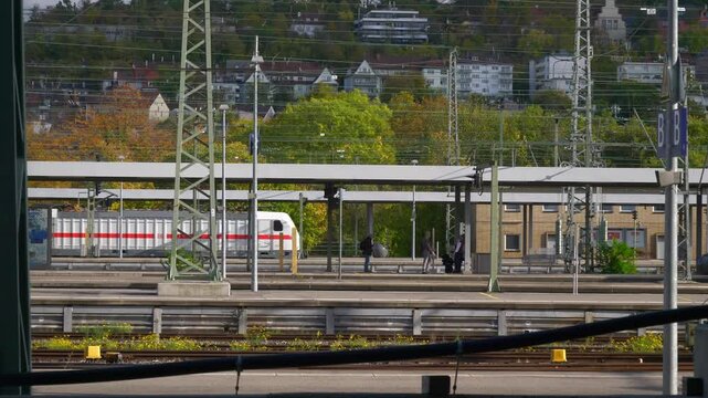 sunny day stuttgart city train station platform wires slow motion panorama 4k germany