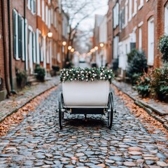 Fototapeta premium A charming cobblestone street with a decorative cart in a quaint neighborhood.