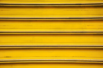 Obraz premium Entrance to the Storage. Yellow Metal Gate Background