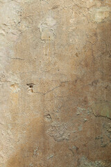 Background - beautiful old beige concrete wall partially illuminated by the sun