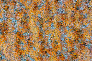 Metal surface covered with corrosion spots of different shades, rusted metal surface background