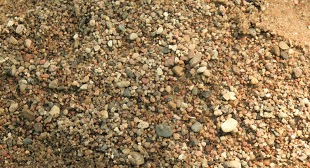 the beach is strewn with small pebbles