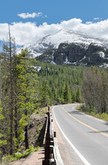 Bear Lake Road with snow capped mountains beyond, Rocky Mountain National Park, Colorado, USA