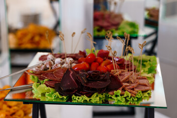 Exquisite Charcuterie Board with Assorted Meats and Fresh Tomatoes