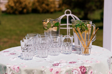 Refreshing Summer Beverage Setup with Mojito Ingredients and Elegant Glassware