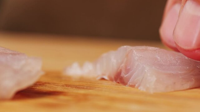 Cooking fish Peruvian ceviche close-up. Fresh cooked ceviche made of raw white fish. Traditional Peruvian cuisine. Cooking seafood dish.