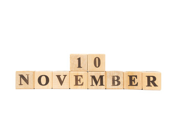 November 10, Wooden cube on isolated white background. China, World Trade Organization, Taiwans membership, National Pupusa Day, International Tongue Twister Day