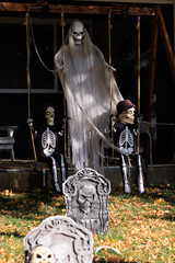 Various colorful Fall and Halloween yard and porch decorations