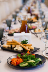 Elegant Table Setting with Fresh Vegetables and Dishes