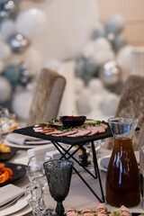 Elegant Banquet Table Displaying Gourmet Charcuterie and Refreshing Beverage