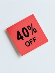 Black '40% OFF' Text on a Red Square Paper Note. White Background 