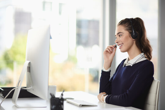 Business woman, talking and call center computer of telesales intern at desk with online consultant. Headphones, office staff and startup with professional and web email with crm, digital and tech