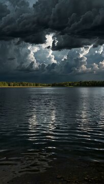 Storm clouds rolling over a calm lake, creating dramatic contrast.