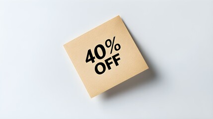 Black '40% OFF' Text on a Light Brown Square Paper Note. White Background with Copy Space