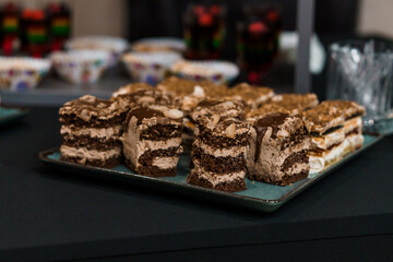 Delicious Chocolate Layered Dessert with Crumbled Toppings on Display