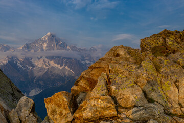 The Petit Dru mountain summit displays rugged peaks and rocky formations against clear sky. Rocky peak of Aiguilles de Dru, les Drus in Chamonix Alps