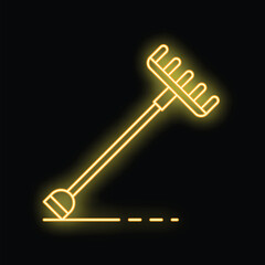 Yellow neon sign of a rake leaning on a black background with copy space