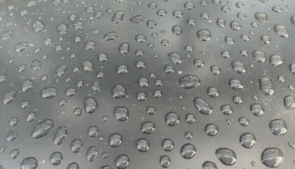 drops of water, rain on a silver background. Yellow leaf on a silver background