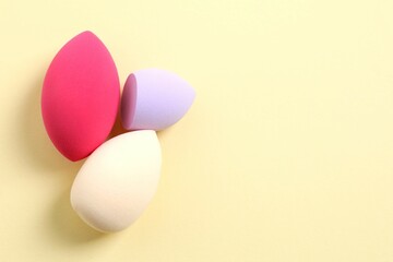 Beauty blender on a color background. Bright sponges for make-up cosmetics. Make-up products. Beauty concept